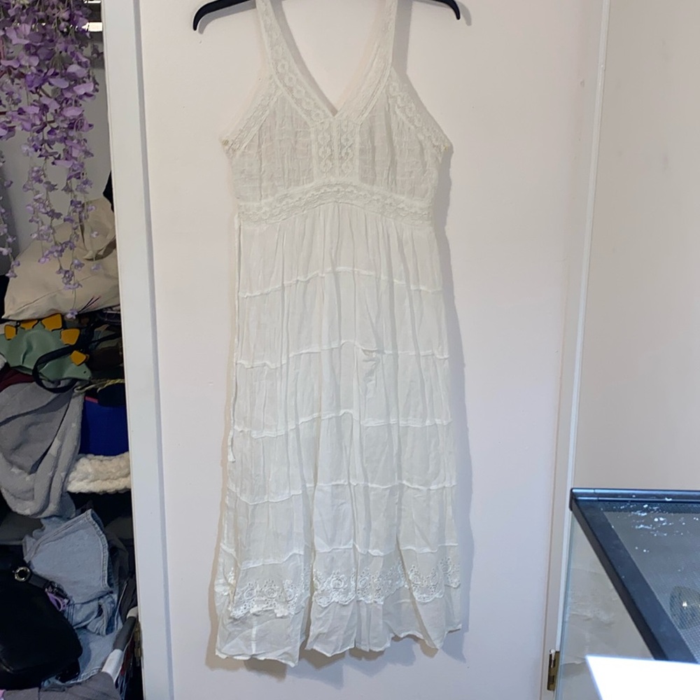 Medium white maxi dress with crochet designs and strings to sinch the dress